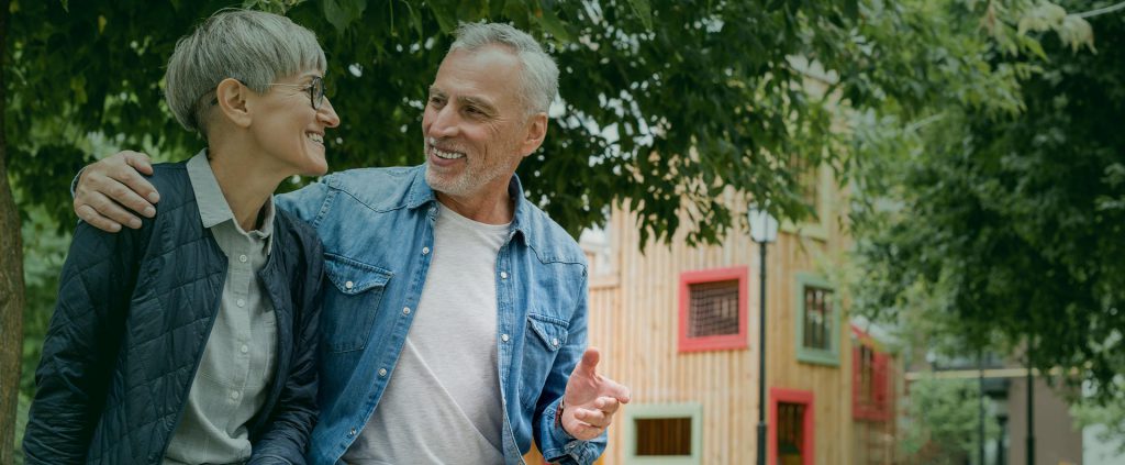 Senior couple smiling with dental implants