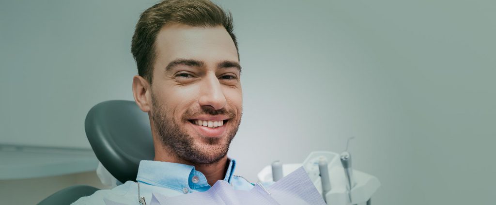 Man smiling at the dental clinic