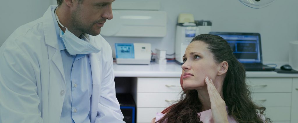 Woman talking to the dentist