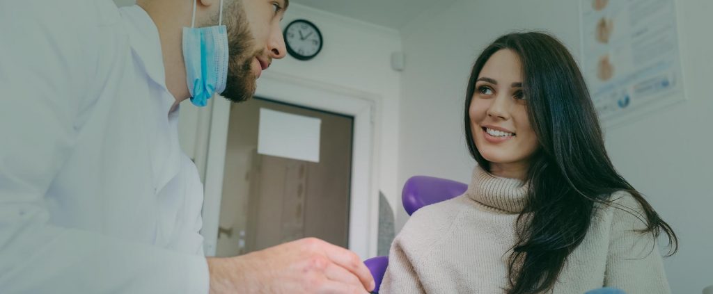 Dentist talking to his patent