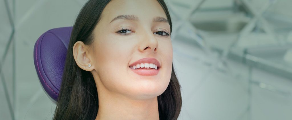 Woman smiling at the dental